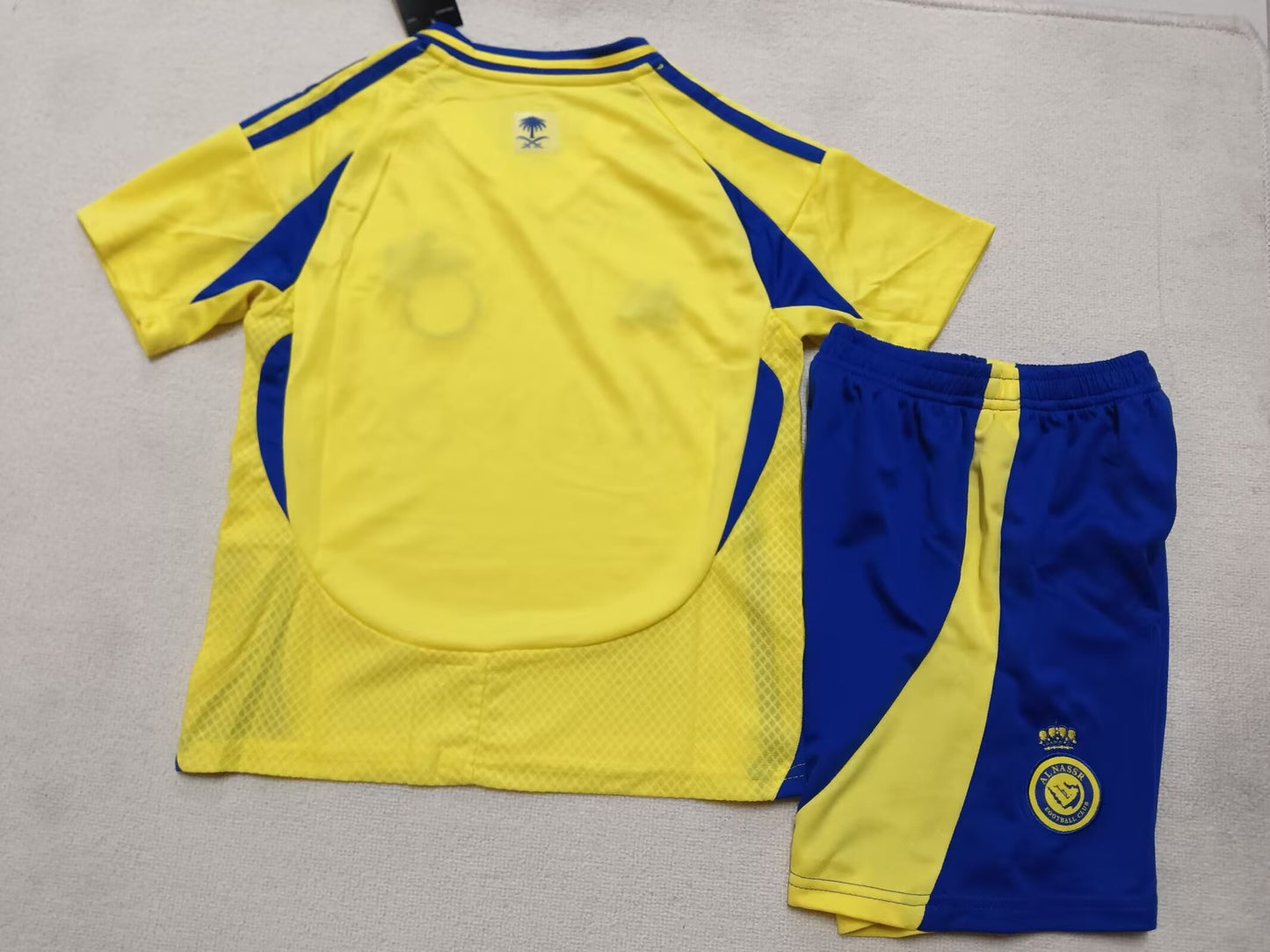 AL NASSR kids home shirt 24/25