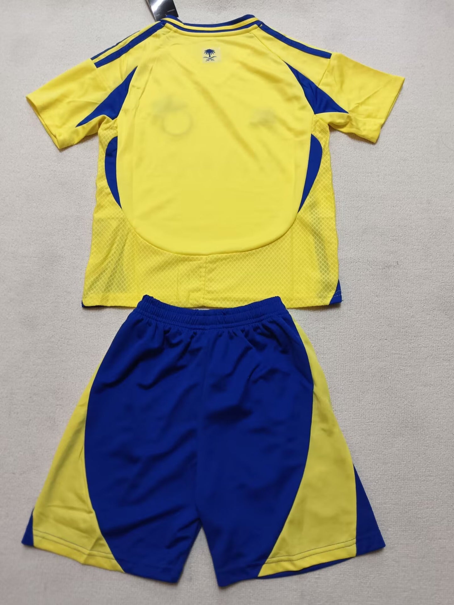 AL NASSR kids home shirt 24/25