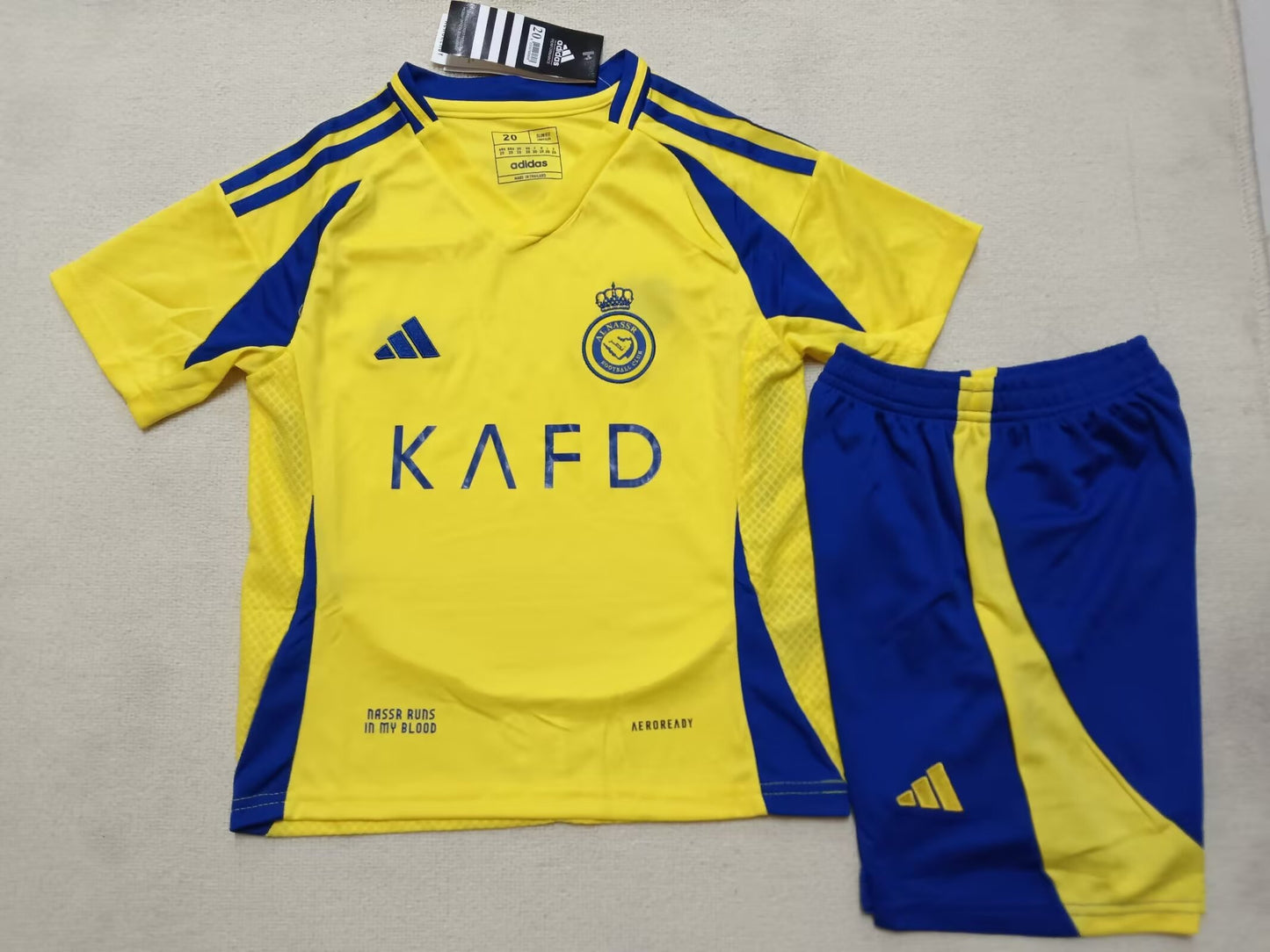 AL NASSR kids home shirt 24/25