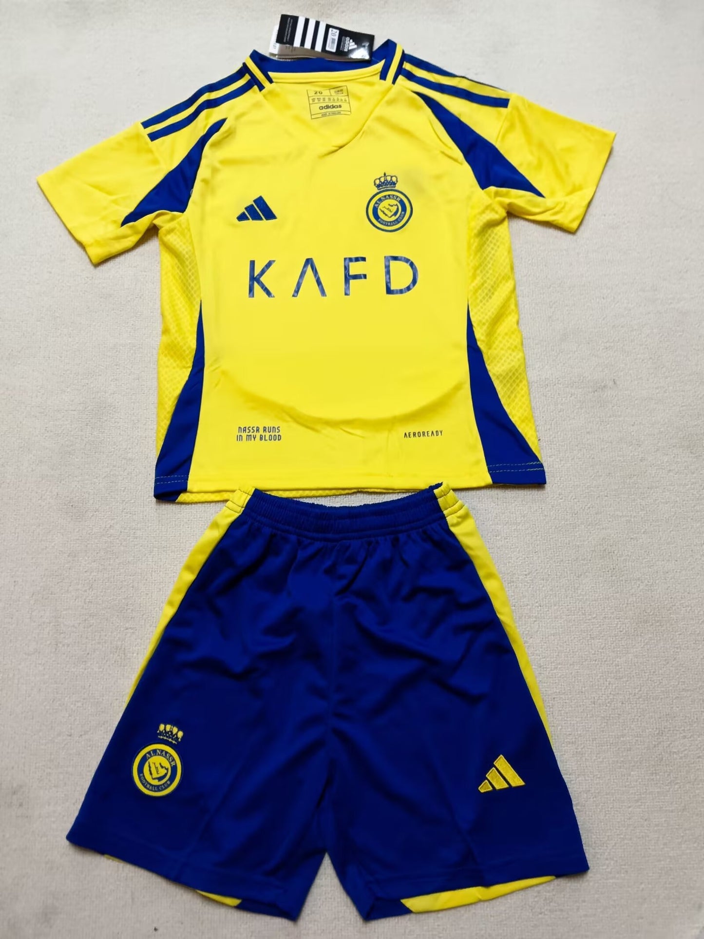 AL NASSR kids home shirt 24/25